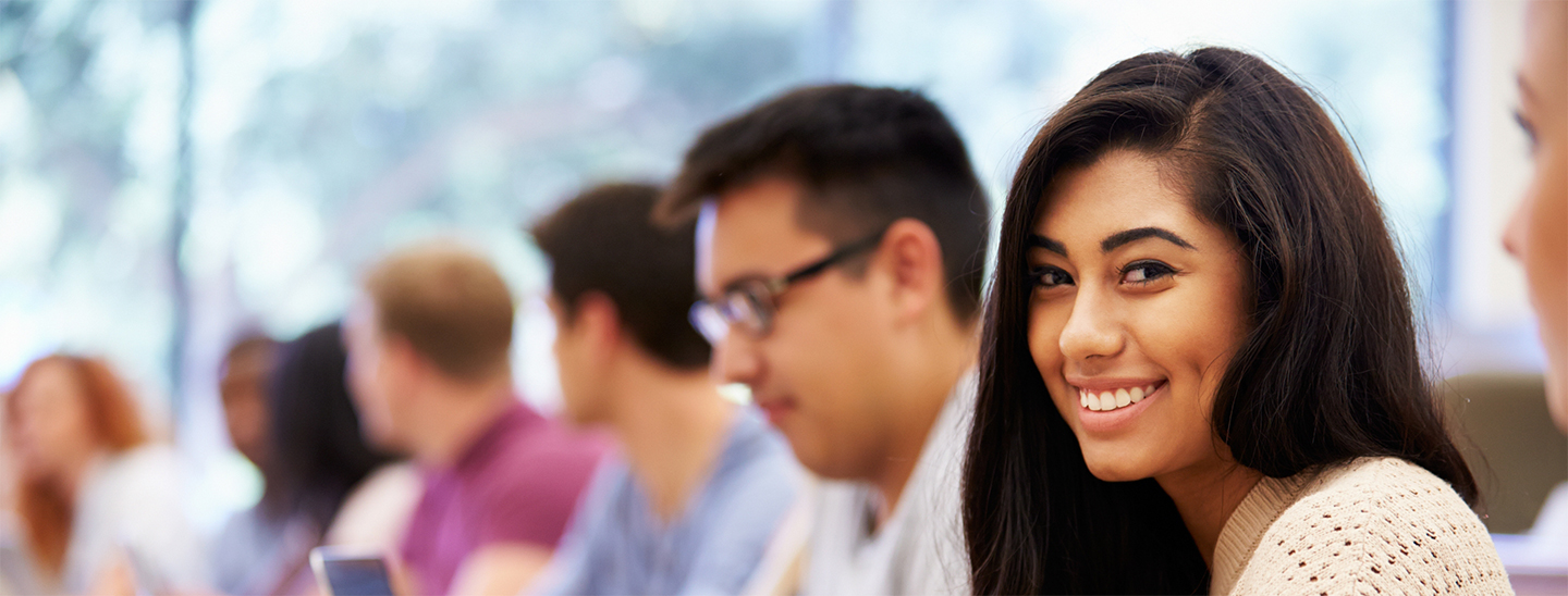 Student in class smiling happy