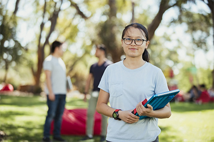 Student outside campus happy