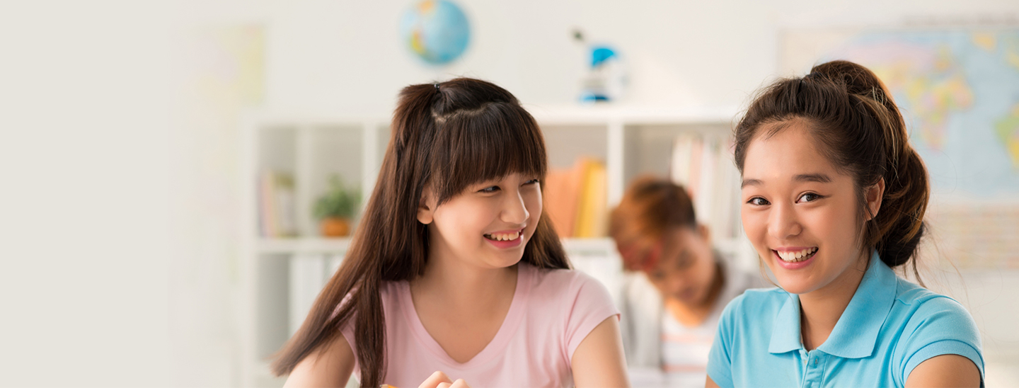 Students in class smiling together happy