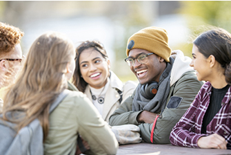 Students sitting around table