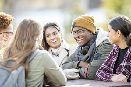 Students sitting around table