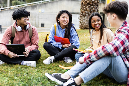 Students sitting around together happy laughing