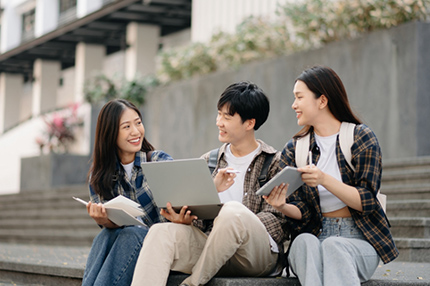 Students sitting stairs together