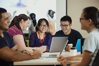 Students together in class studying