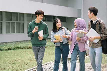 Students walking together outside socialising